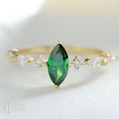 ✅ Introducing our dainty and sympathy 14K solid gold marquise cut emerald green birthstone & gemstone ring, a true embodiment of minimalistic elegance. Handcrafted & handmade with meticulous attention to detail, this unique engagement, wedding or promise rings showcases a chevron design that is both sleek and sophisticated. It serves as a perfect gift for her, symbolizing your everlasting love and commitment. ❇️ This ring can also be worn as a wedding band, offering a timeless beauty that will c Emerald Engagement Ring Diamond, Birth Month Stones, Gemstone Wedding Rings, Moissanite Wedding Band, Engagement Ring Diamond, Emerald Diamond Ring, Emerald Engagement, Chevron Design, Moissanite Wedding Bands