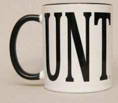 a black and white coffee mug with the word unt on it's side