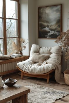 a living room with a chaise lounge chair in front of a large painting on the wall