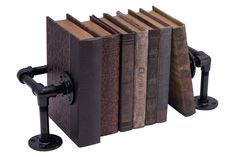 an old fashioned book holder is holding several books