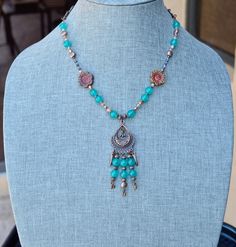 This boho copper beaded necklace is a beautiful blend of beads and makes great summer jewelry.  It has lots of copper on it, four tree of life copper connector charms, two beautiful czech glass table cut flower beads, agate gemstone beads, czech fire polish ab beads in three different colors and sizes and two different beautiful colors in light blue and rich purple-wine very tiny crystal bicone beads.  The colors blend so well together and accent each other as well.  There is a pretty toggle cla Bohemian Crystal Necklaces With Natural Stones In Copper, Bohemian Copper Crystal Necklaces With Natural Stones, Bohemian Beaded Necklaces With Natural Stones And Copper, Bohemian Beaded Necklace With Natural Stones And Copper, Bohemian Necklace With Dangling Beads, Bohemian Copper Wire Wrapped Crystal Necklaces, Bohemian Festival Necklace In Copper, Bohemian Copper Necklace For Festivals, Bohemian Copper Necklace For Festival