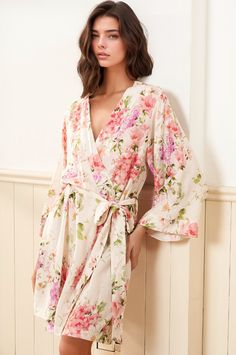 This elegant floral robe showcases an exclusive, romantic print on luxuriously soft, high-quality rayon. Meticulously designed for versatile wear, it’s the perfect addition to any woman's wardrobe. Whether used as a bridesmaid or bridal robe, a maternity robe, or as a stylish pool or beach cover-up, this robe is a one-of-a-kind keepsake. FABRIC: 100% Rayon LENGTH: Top of shoulder to hem 36" STYLE: PJ-18088 in SOFT KISS IVORY - SOFKI-P99 *Model is wearing size small *Machine was on cold, and hang Bridesmaid Robes Floral, Floral Pajama Set, Romantic Floral Print, Dream Lover, Lounge Looks, Floral Bridesmaid, Bridal Robe, Yumi Kim, Floral Pajamas