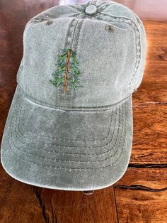 "Embroidered pine tree \"dad cap\". Available on washed green or gray adjustable cap." Cute Hats For Women Ball Caps, Embroidered Photo, Group Gifts, Ball Caps, Dad Cap, Tree Farm, Womens Baseball Cap, Dad Caps, Outfits Men