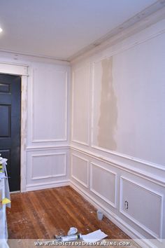 an empty room with white walls and wood flooring in the process of remodeling