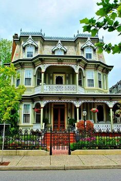 a large victorian style house with lots of windows