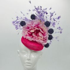 Handmade by Featured Milliner of The Kentucky Derby Museum 2023 & 202 Pink peony with light purple feather burst & dark purple pops. Gorgeous garden-like Kentucky Derby Fascinator.  Attaches with elastic.  Not taking customs this year--Derby 150 is going to be massive and mom life keeps me running! However, happy to suggest pieces that will coordinate with your outfit. If you don't love the way this attaches to your head--message me!  I can swtich *most* pieces to your preference. Clip, Headband Purple Feather Headpieces For Spring, Purple Mini Hats With Feathers For Kentucky Derby, Purple Handmade Flowers Headpiece For Kentucky Derby, Purple Headpiece With Handmade Flowers For Kentucky Derby, Summer Purple Feathered Fascinator, Purple Feathered Mini Hats For Kentucky Derby, Purple Feathered Hat For Kentucky Derby, Purple Mini Hats For Spring Races, Purple Feathered Mini Hat For Summer