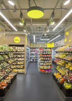 a grocery store filled with lots of fresh fruits and veggies in it's aisles