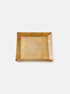 an empty gold plate on a white background