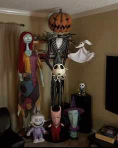 a living room filled with halloween decorations and furniture