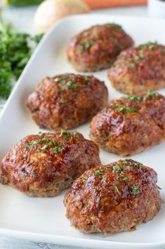 mini balsamic turkey meatloaf on a white platter with parsley