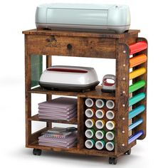 a wooden cart filled with lots of crafting supplies on top of a white background