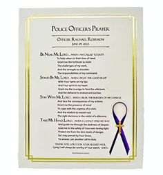 an award plaque with a purple ribbon on it