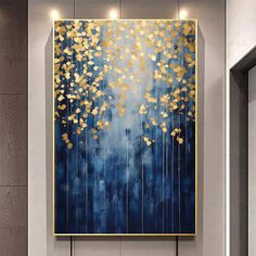 a blue and gold painting hanging on the wall