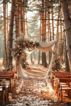 an outdoor ceremony setup with white flowers and greenery on the aisle, surrounded by tall trees