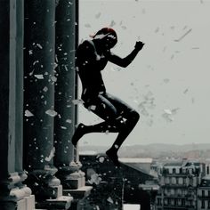 a person jumping off the side of a building into the air