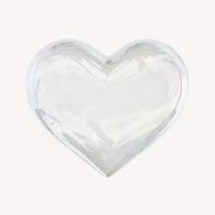 a clear heart shaped object on a white background