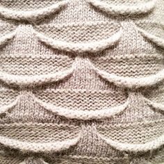 a knitted sweater with wavy lines on it