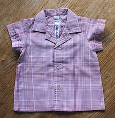 "FRENCH vintage 70's, very cute little baby summer shirt, checkered light fabric ( cotton 33 %, polyester ). Brand \" petit diable \". Measurement :  Length \" / Width ( shoulders ) \" Size 6 months Vintage condition level 5, new old stock ( washed once ). We assess the condition of our vintage items on a scale from 0 to 5. Level 5 corresponds to an almost new vintage condition. Any defects are systematically reported. Even though in very good condition, vintage items may present imperfections d Cute Plaid Short Sleeve Tops, Cute Short Sleeve Plaid Tops, Pink Shirt For Summer Playtime, Vintage Cotton Tops For Playtime, Vintage Cotton Top For Picnic, Vintage Gingham Cotton Tops, Pink Cotton Top For Picnic, Pink Cotton Tops For Picnic, Baby Summer