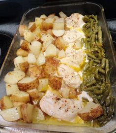 chicken, potatoes and green beans in a casserole dish on top of the stove