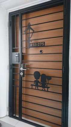 an image of a door that has been painted with the silhouettes of two people