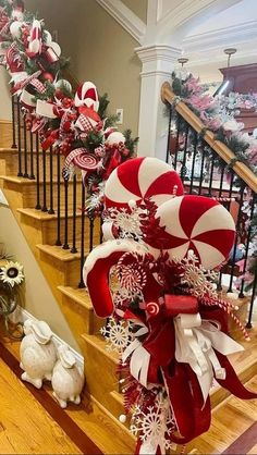 some candy canes and snowflakes are on the stairs