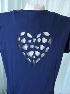 a blue shirt with white hearts cut out of it