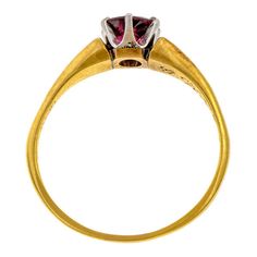 Fashioned in platinum and 14k yellow gold. Hand engraved with date "Jan. 1, 1915". Size 6 1/2. Antique Yellow Gold Ruby Ring With Brilliant Cut, Antique Style Brilliant Cut Yellow Gold Ruby Ring, Antique Engraved Yellow Gold Ring With Brilliant Cut, Antique Yellow Gold Engraved Ring With Brilliant Cut, Antique Yellow Gold Ruby Ring With Polished Finish, Antique Gold Ruby Ring With Brilliant Cut, Classic Engraved Ruby Ring For Formal Occasions, Classic Engraved Ruby Ring, Elegant Engraved Ruby Ring In Yellow Gold