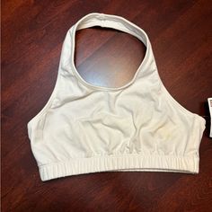 Nwt Halter Sports Bra (White), Size Medium. Item Just Didn’t Fit Properly, Needed A Smaller Size. There Is A Small Yellowish Stair (Pictured), I Think It’s From Makeup When Trying On. Item Has Never Been Worn, Pet Free And Smoke Free Home. White Stretch Racerback Crop Top, White Sporty Crop Top With Built-in Bra, White Racerback Crop Top With Medium Support, White Medium Support Racerback Crop Top, White Fitted Crop Top With Moisture-wicking, Basic White Top With Built-in Bra, White Sleeveless Sports Crop Top, White Sleeveless Crop Top For Sports, Cotton Racerback Crop Top For Sports