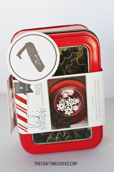 a red tin with some food in it and a white sticker on the top