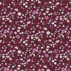 a red and purple flowered background with small white flowers on the bottom right corner