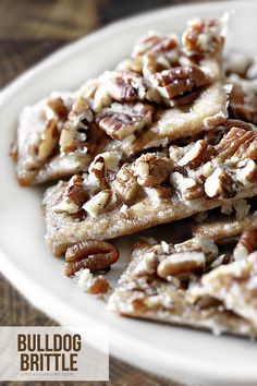 a white plate topped with lots of pecans