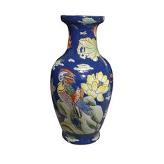 a blue vase with birds and flowers painted on the front, sitting on a white background