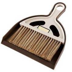 a brush with wooden handle on a white background