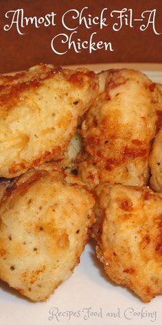 some fried food on a white plate with the words almost chicken filler written above it