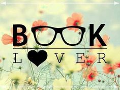 the words book lover written in front of a field of flowers with glasses on it