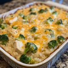 a casserole dish with broccoli and chicken in it on a counter