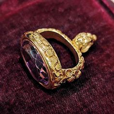 An amazing Victorian era fob seal, set with a large, oval amethyst to the base, mounted in a decorative engraved setting, crafted in 15ct yellow gold. An elegant item which would once have likely hung from a watch chain. A fine and heavy piece of antique jewellery.Circa 1850.Unmarked, tested as 15ct gold.The fob measures approximately 32 x 27mm.The seal face measures 19.7 x 15.3mm.The approximate weight is 17.2 grams.CONDITION: In overall very good antique condition, with some wear commensurate Luxury Gold Oval Amethyst Ring, Luxury Gold Amethyst Ring Gift, Victorian Gold Oval Amethyst Ring, Luxury Hallmarked Amethyst Collectible Ring, Luxury Oval Amethyst Collectible Ring, Ornate Oval Amethyst Ring, Heirloom Gold Amethyst Oval Ring, Antique Amethyst Ring In Yellow Gold For Gift, Heirloom Gold Oval Amethyst Ring