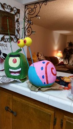 two stuffed animals sitting on top of a counter