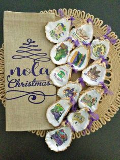 some cookies are sitting on a plate with purple ribbon around it and the words noel christmas