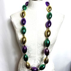 Mardi Gras Football Krewe Throw Purple Green Gold Beads Nwt New With Tags New Old Stock - 2004 Large Football Purple Green Gold Great For Party Decor Or Wear To Mardi Gras Get Ready For Super Bowl 21” Drop Buy In Multiples Of Three And Get 20% Off Oval Beaded Chain For Party, Round Beads Jewelry For Mardi Gras Party, Party Beaded Necklaces With Oval Beads, Colorful Beads Jewelry For Mardi Gras Party, Colorful Beaded Jewelry For Mardi Gras Party, Party Beaded Necklaces With Colorful Oval Beads, Colorful Oval Beaded Necklaces For Party, Wire Choker Necklace, Vintage Choker Necklace