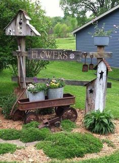 an old wagon is used as a planter and flower pot holder in the garden