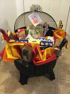 a basket filled with lots of items on top of a tiled floor