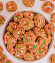 a bowl full of cookies with sprinkles and candy on the top one