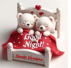 two white teddy bears sitting on top of a bed with the words good night sweet dreams