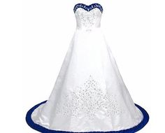 a white and blue wedding gown on a mannequin with sequins in the skirt