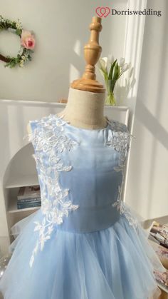 ☁💙 Sky Blue Dream Delivered! 💫 Your little princess will twirl in delight wearing this short flower girl dress. Featuring a sky-blue satin top, a ruffled tulle skirt, and delicate white appliques, it's pure magic. With options in 60 enchanting colors and 14 sizes, you can customize this dress to perfection. Make her moment unforgettable in this whimsical gown! 🌟 #FlowerGirlDress #SkyBlueElegance #RuffledSkirt #CustomColors Whimsical Gown, Blue Satin Top, Flowergirl Dress, Ivory Gown, Blue Dream, Satin Top, Flower Girl Dress, Blue Satin, Girl Dresses