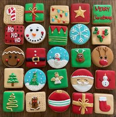 christmas cookies are arranged on a wooden table