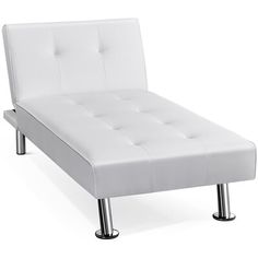 a white bed sitting on top of a metal frame