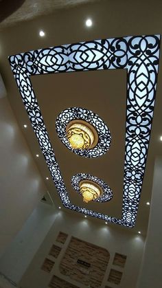 the ceiling is decorated with intricate designs and lights