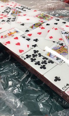 several playing cards on plastic wrapped in plastic